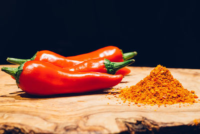 Close-up of red chili peppers on table