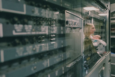 Portrait of woman standing inside concorde 