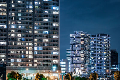 Modern buildings in city at night