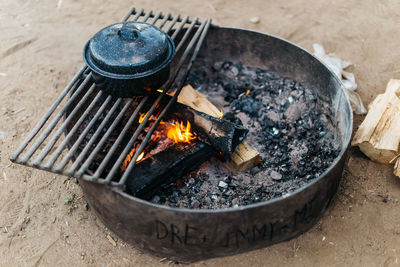 High angle view of fire on barbecue grill