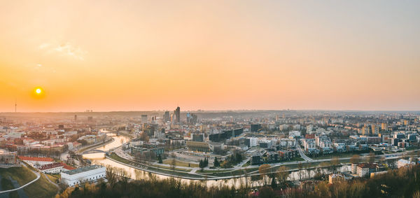 High angle view of city buildings during sunset