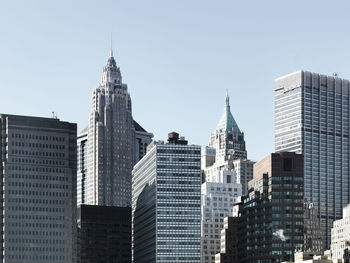 Low angle view of tall buildings against clear sky