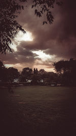 Scenic view of field against sky during sunset