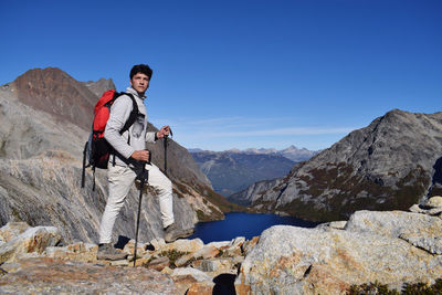 Man standing on mountain against sky