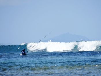 Man fishing on sea