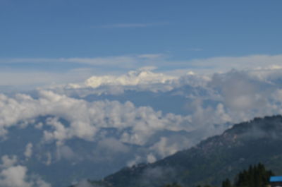 Aerial view of clouds over mountain