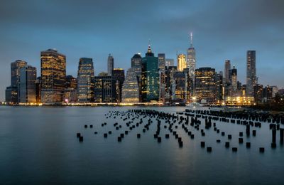 Panoramic view of people in city against sky