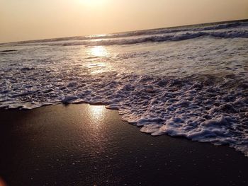 Scenic view of sea against clear sky during sunset