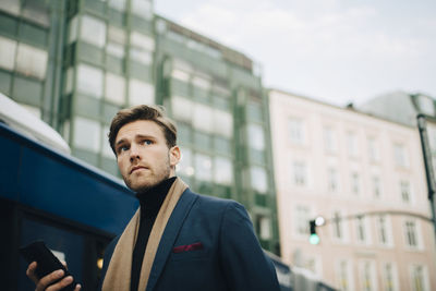 Portrait of young man looking away