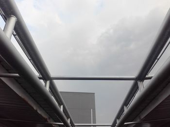 Low angle view of bridge against sky in city