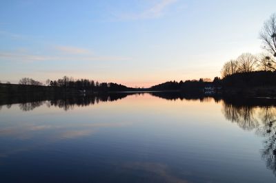 Scenic view of lake against sky during sunset