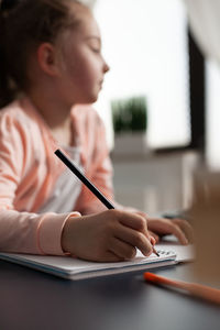 Cute girl writing in diary