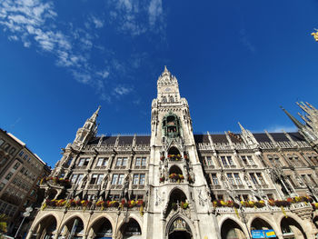 Low angle view of buildings against blue sky