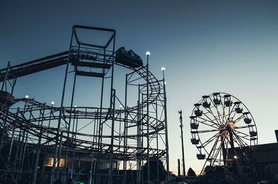 Low angle view of ferris wheel against sky