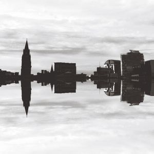 Buildings against cloudy sky