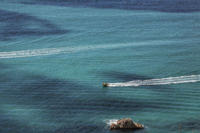 High angle view of ship sailing in sea