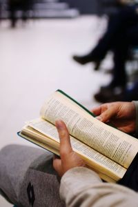 Close-up of hand holding book