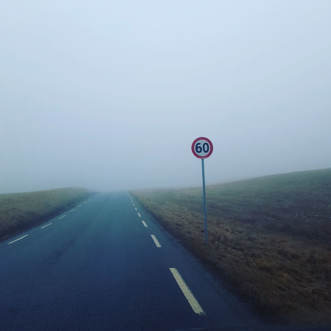 road sign, information sign, guidance, nature, communication, no people, outdoors, sky, the way forward, day, fog, road, landscape, beauty in nature