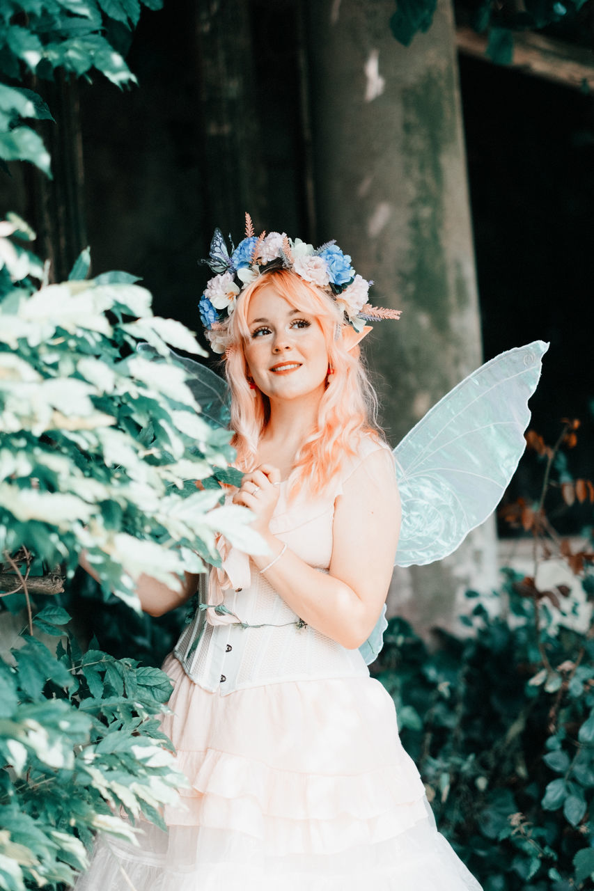women, adult, fashion, one person, clothing, young adult, happiness, celebration, portrait, smiling, nature, emotion, event, dress, plant, female, flower, white, bride, royalty, person, crown, fairy, costume, elegance, fairy tale, looking at camera, wedding dress, outdoors, headpiece, arts culture and entertainment, blond hair, cheerful, wedding, flowering plant, beauty in nature, positive emotion, newlywed, glamour, ceremony, fun, gown, human face, looking, standing, dancing, leaf