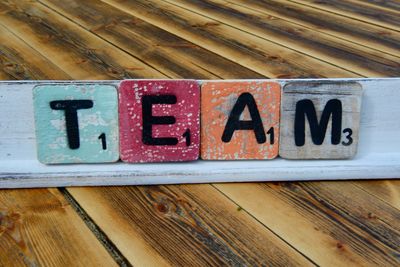 High angle view of text blocks on wooden table