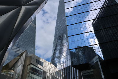 Low angle view of skyscrapers against sky