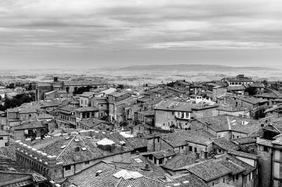 High angle view of buildings in city against sky