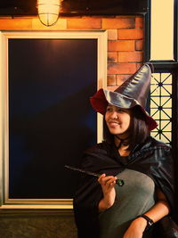 Woman wearing witch costume during halloween