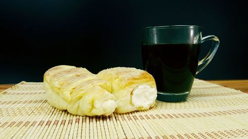Cofee cup cream bread bamboo table