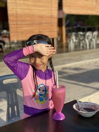 Portrait of young woman wearing swimming suit at the beach