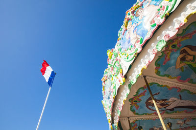 Low angle view of french flag against clear blue sky