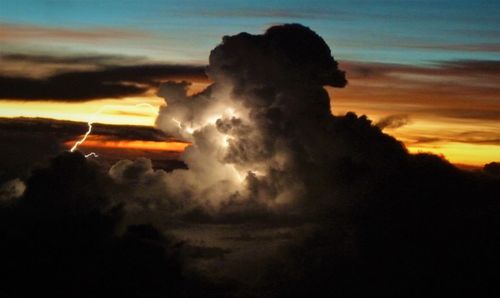 Silhouette man against sky during sunset