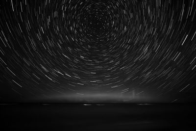 Scenic view of sea against sky at night