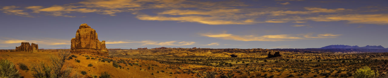 View of rock formations on landscape against sky