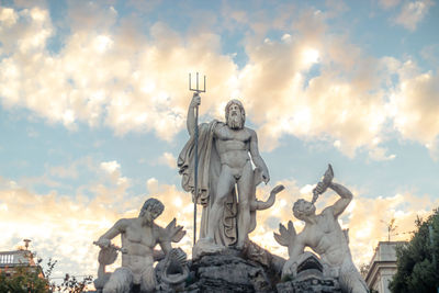 Low angle view of statue against sky