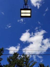 Low angle view of cables against blue sky