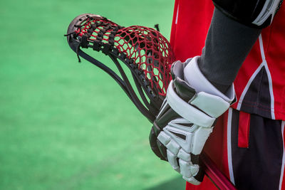 Close-up of sportsperson holding racket