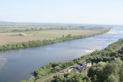 High angle view of landscape and buildings against sky