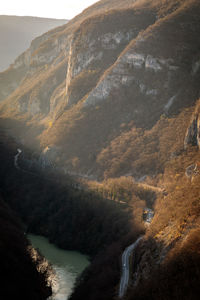 Scenic view of river amidst mountains