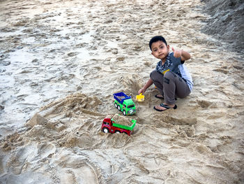 High angle view of boy playing at the beach 