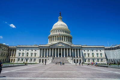 Low angle view of historical building against blue sky