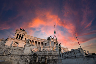 Low angle view of building against sky during sunset