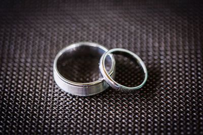 Close-up of wedding rings on table