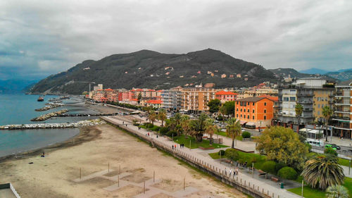 Scenic view of sea and buildings against sky