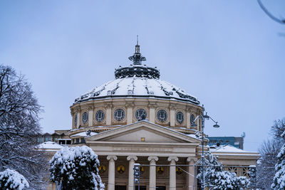 Low angle view of cathedral against sky during winter