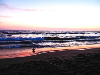 Scenic view of sea at sunset