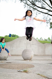 Full length of girl playing at park