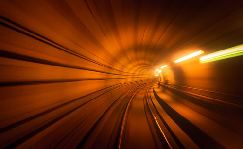 A train is currently traveling through a tunnel filled with many lights