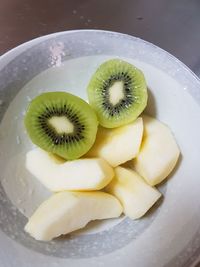 High angle view of fruits in plate on table