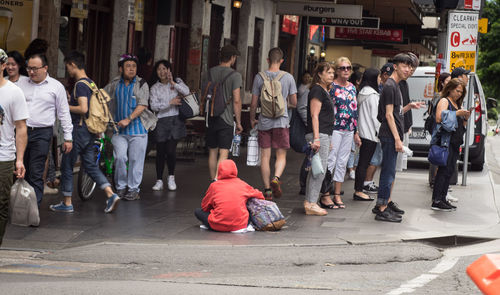 People walking on street in city