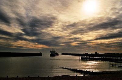 Scenic view of sea against cloudy sky